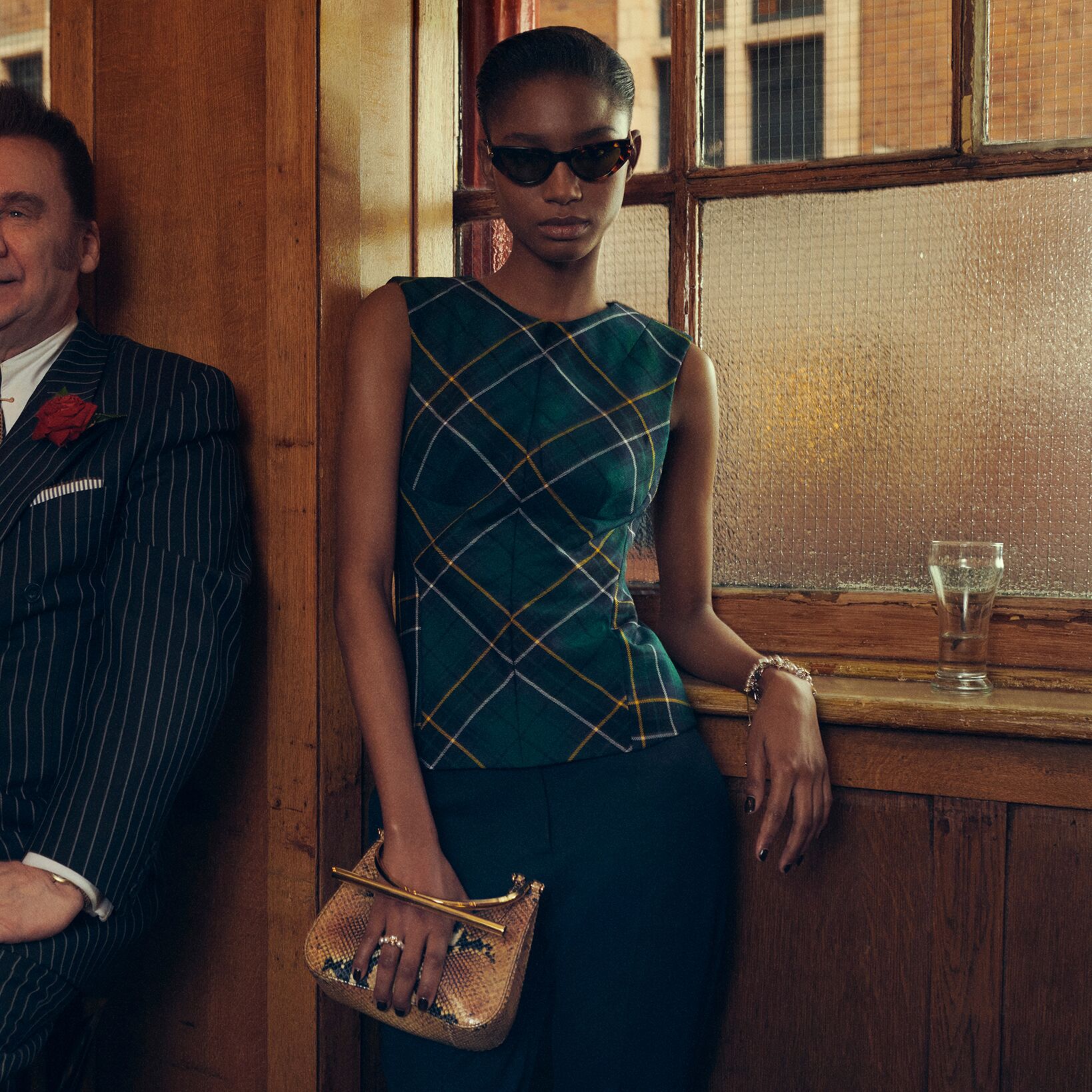 Model holding a McQueen T-Bar bag